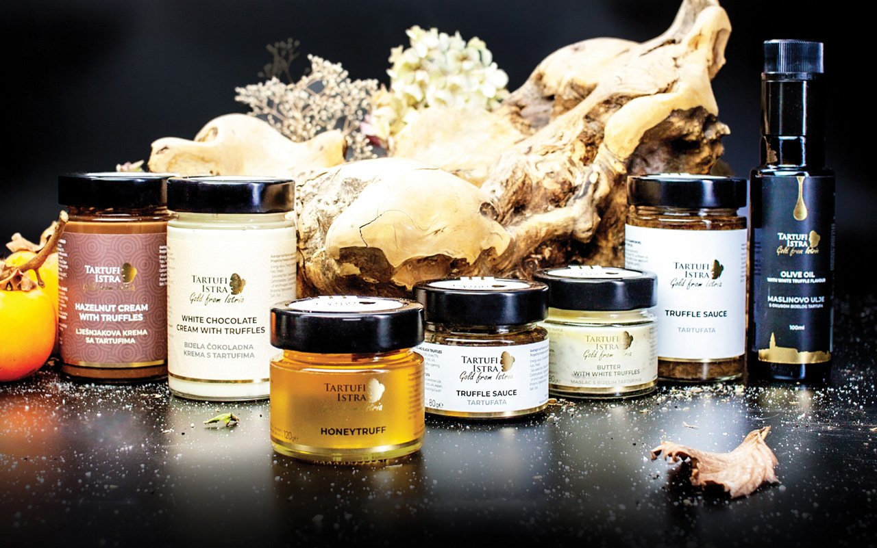 Truffle product jars on wooden surface